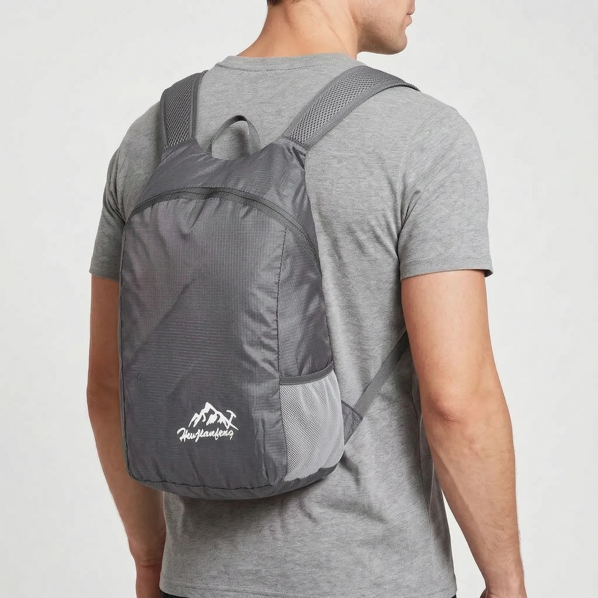 Foldable lightweight day pack with water-repellent material and ventilated mesh straps