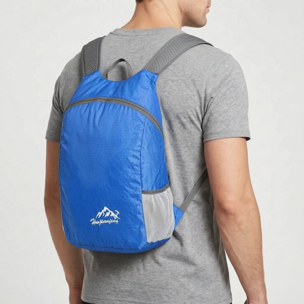 Foldable lightweight day pack with water-repellent material and ventilated mesh straps