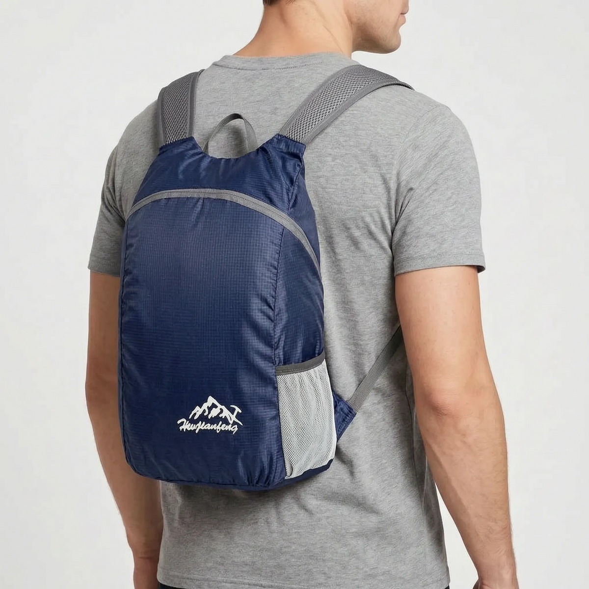 Foldable lightweight day pack with water-repellent material and ventilated mesh straps