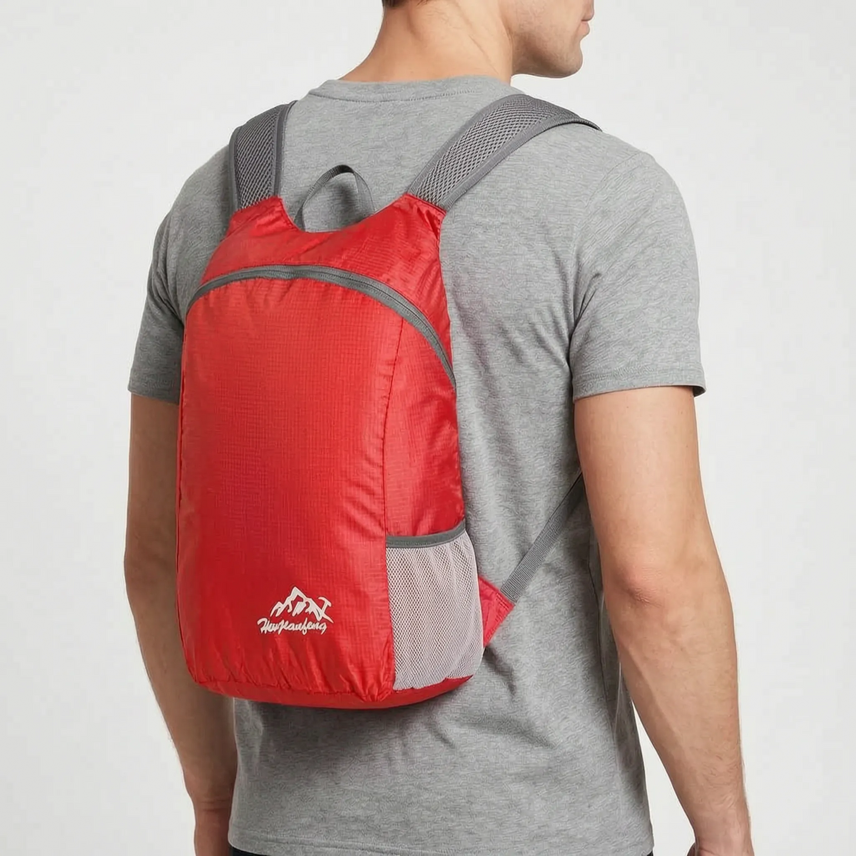 Foldable lightweight day pack with water-repellent material and ventilated mesh straps