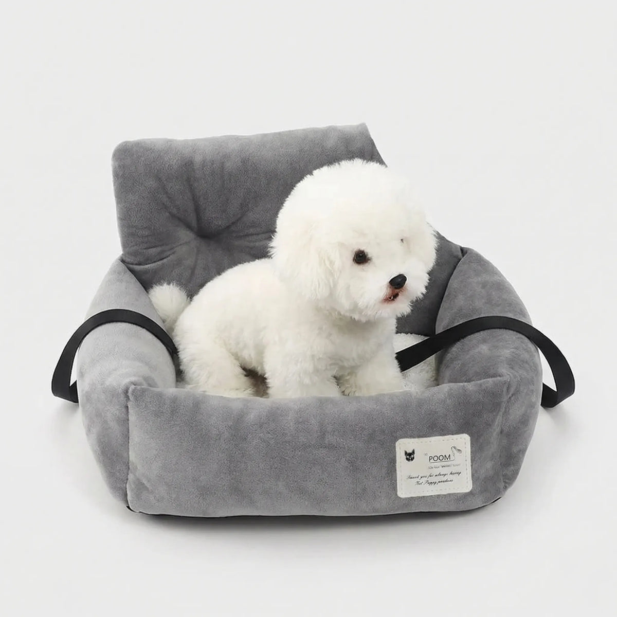 Padded pet car seat with raised backrest and non-slip underside