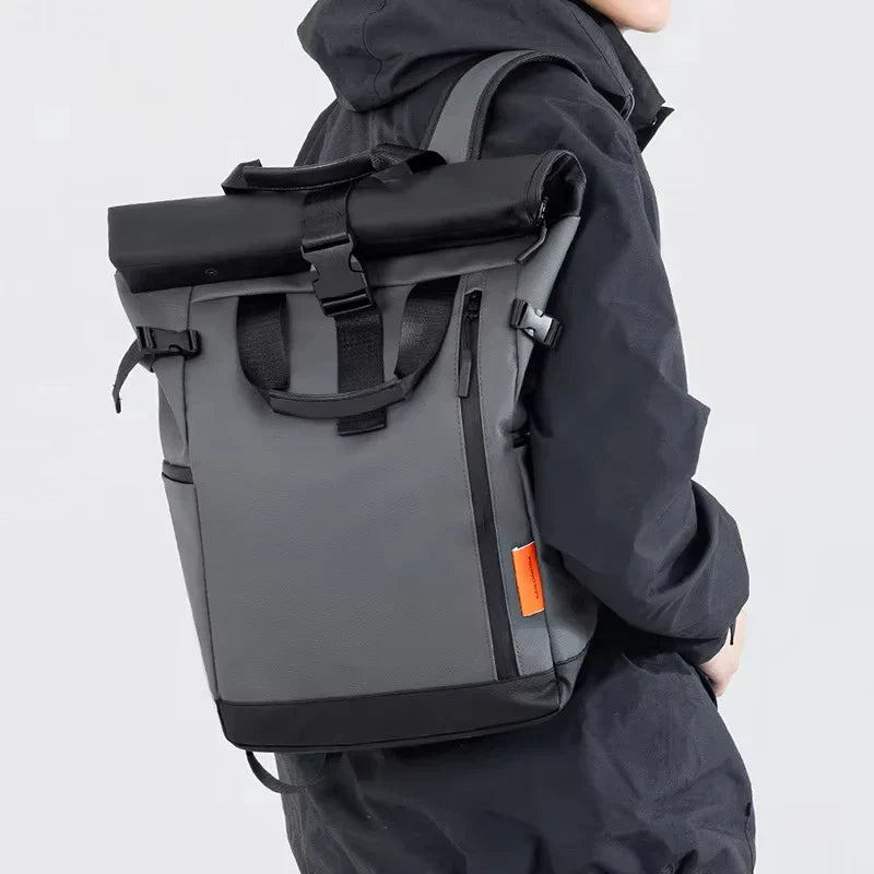 Water-resistant laptop backpack with rolltop closure and luggage carry handle