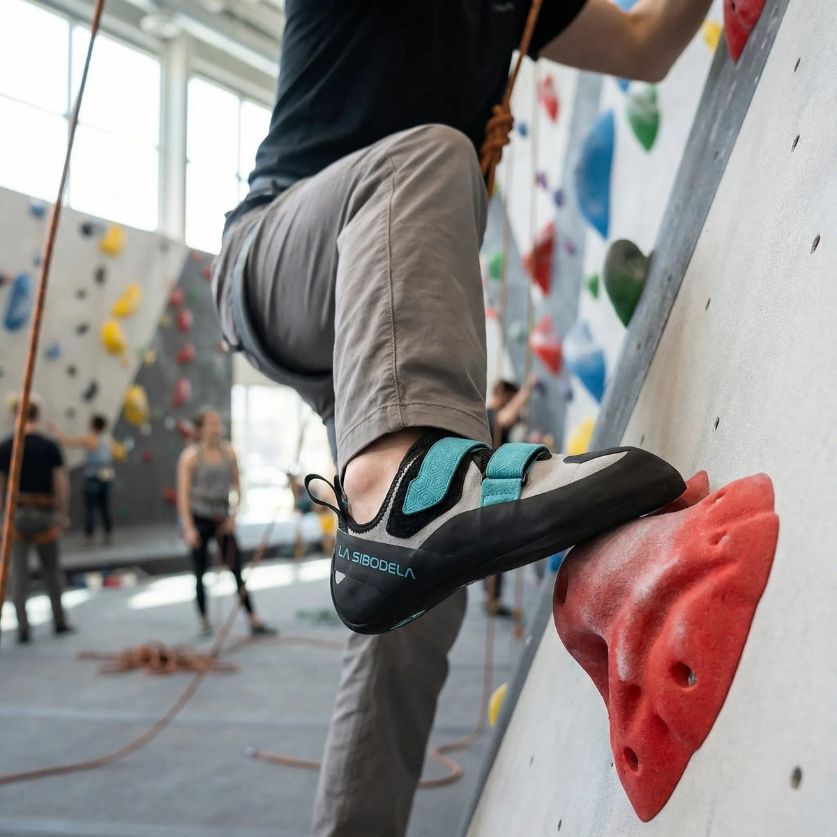 Climbing shoes with velcro straps and grippy rubber sole for indoor and outdoor use