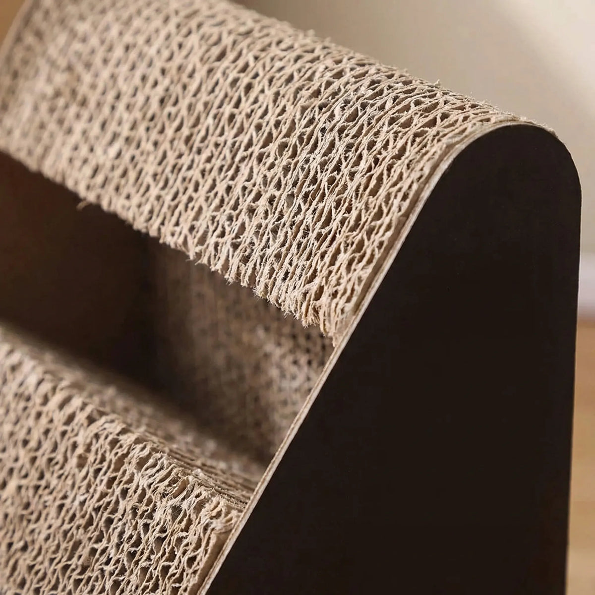 Triangular cat scratching board with upright frame and built-in rolling ball