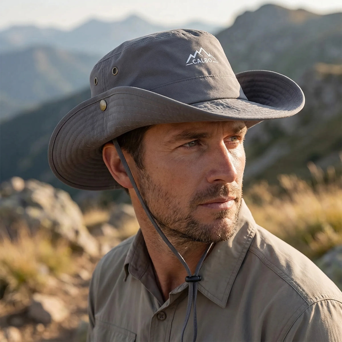 Wide-brim outdoor hat with water-repellent finish and adjustable chin cord