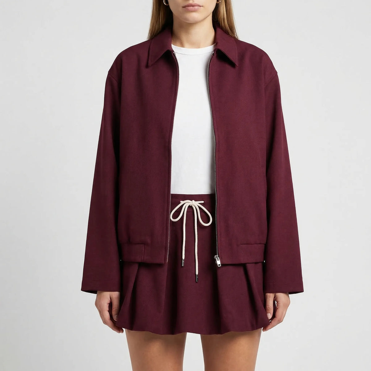 Women's oversized zip jacket and pleated mini skirt set
