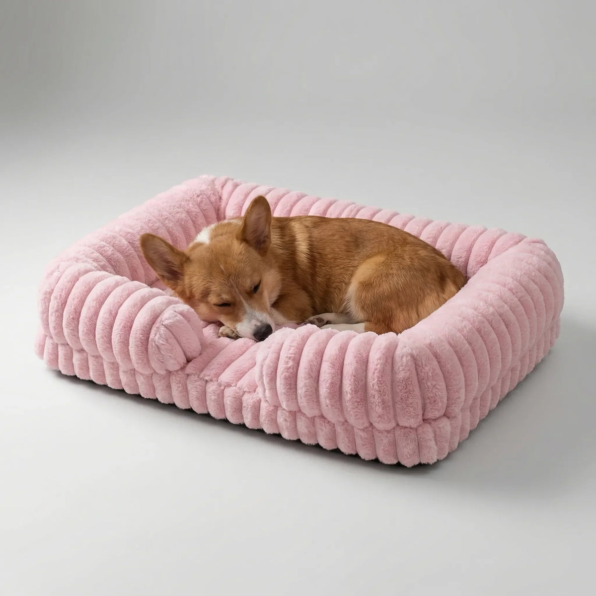 Sofa-style dog bed with raised sides and plush ribbed fabric cover
