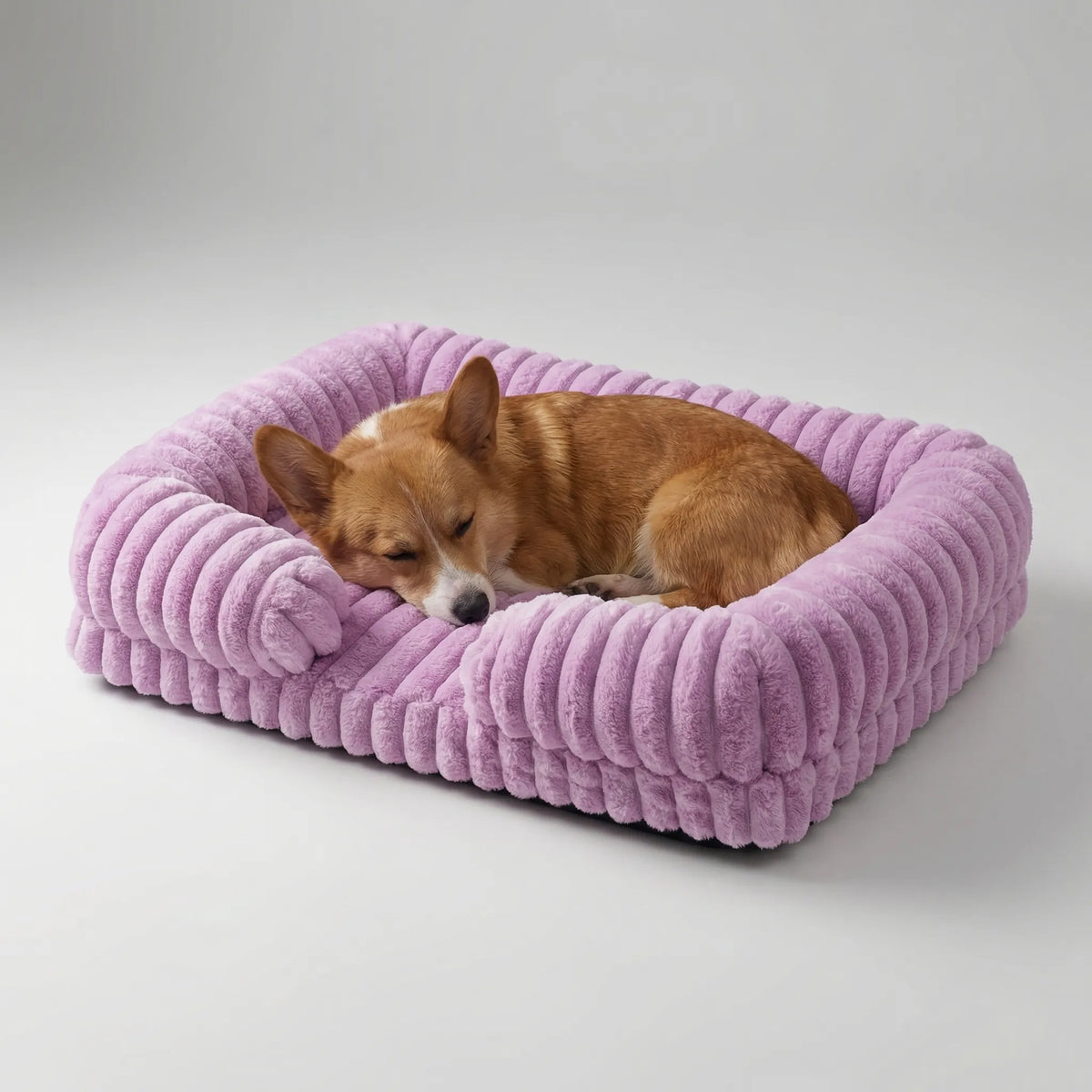 Sofa-style dog bed with raised sides and plush ribbed fabric cover