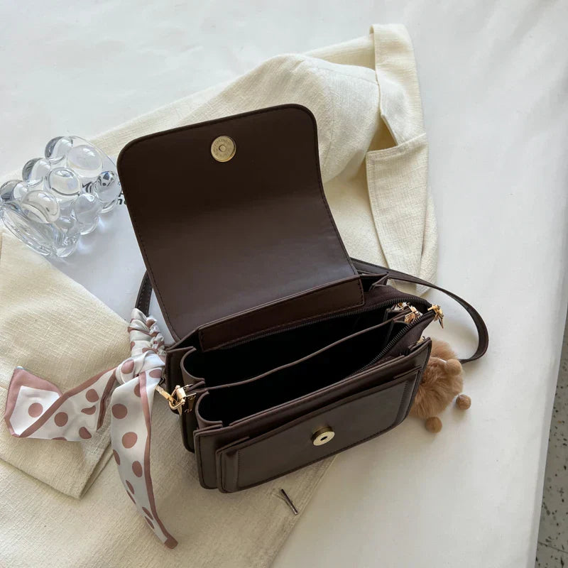 Small square shoulder bag with structured shape and smooth PU material