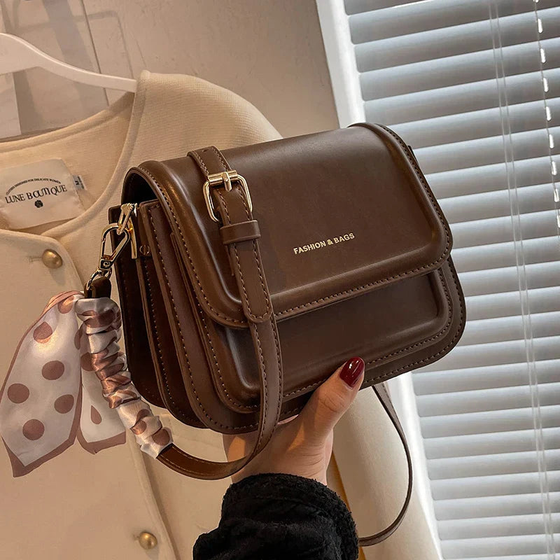 Small square shoulder bag with structured shape and smooth PU material