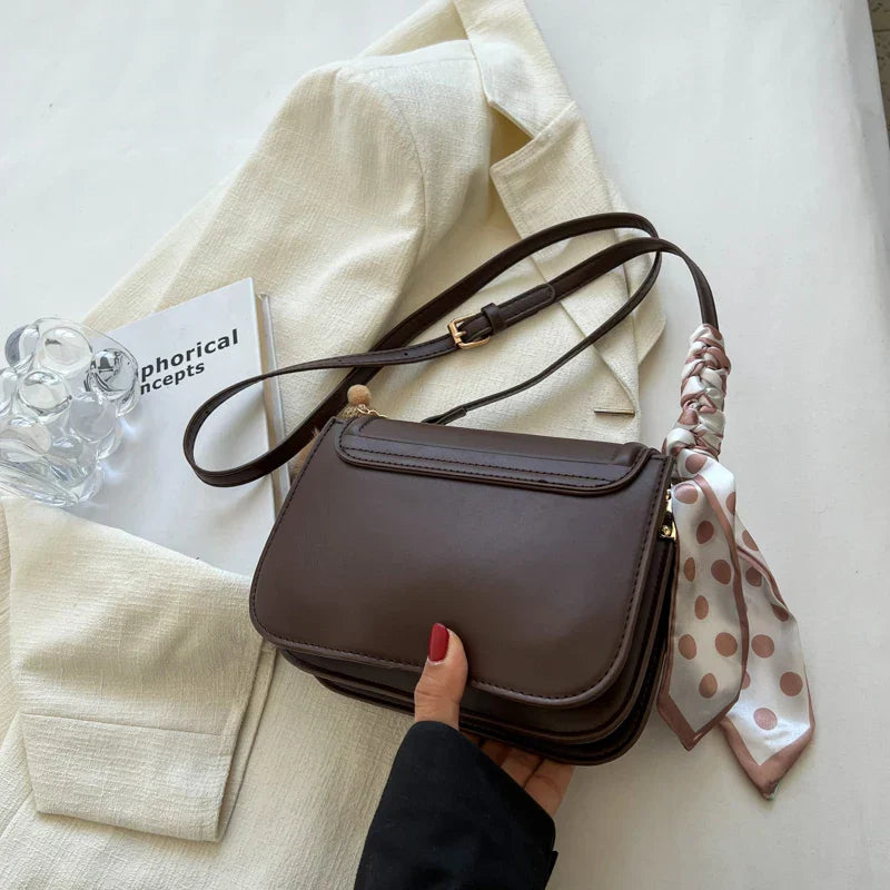 Small square shoulder bag with structured shape and smooth PU material