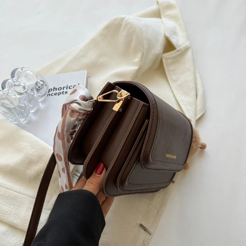 Small square shoulder bag with structured shape and smooth PU material