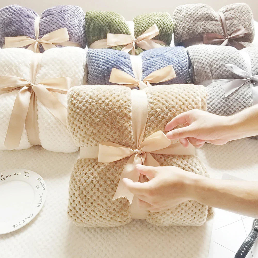Thick knitted throw blanket with silky soft surface