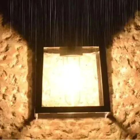 Solar-powered LED wall light with automatic dusk-to-dawn sensor