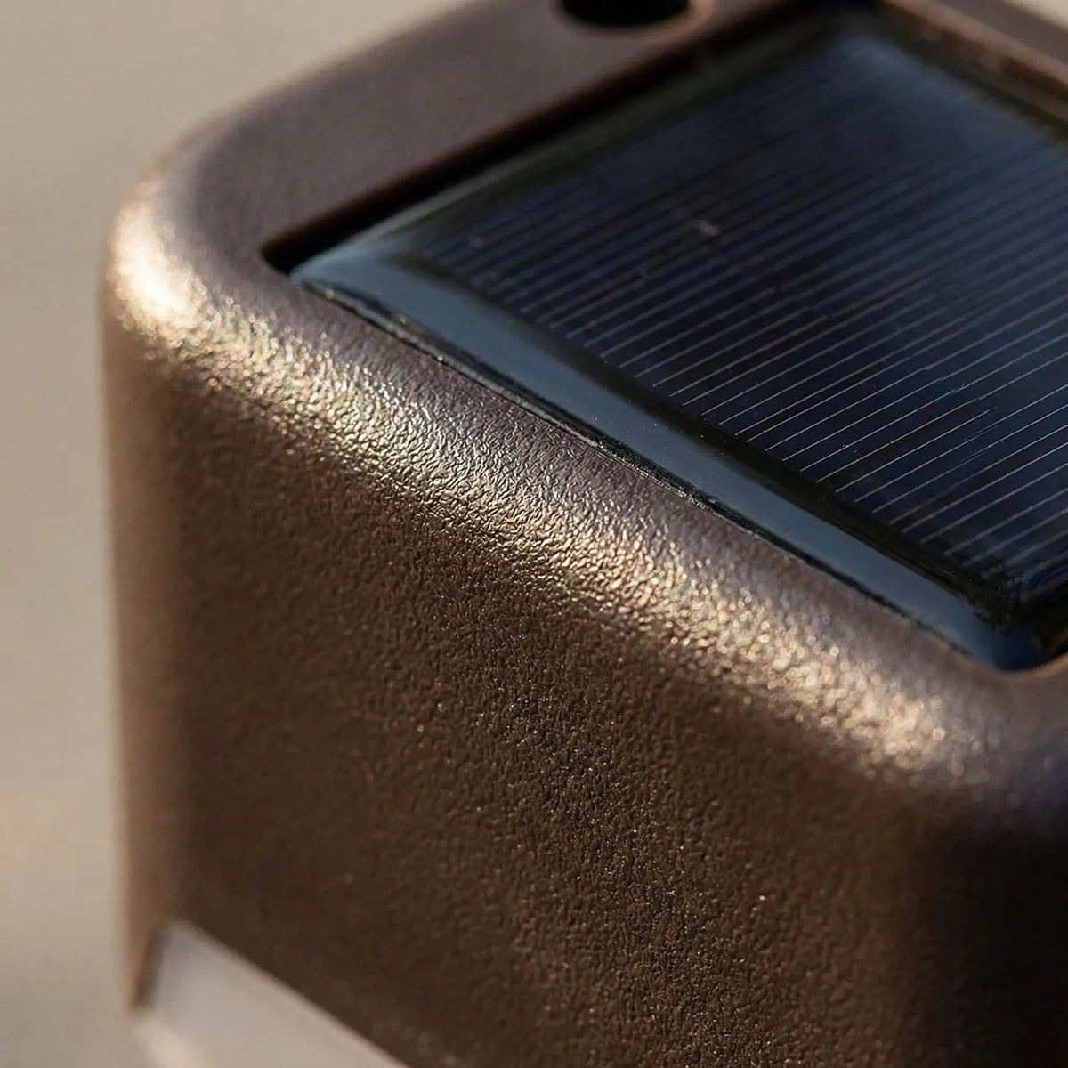 Solar step light with warm LED glow and clip-on mounting for decking
