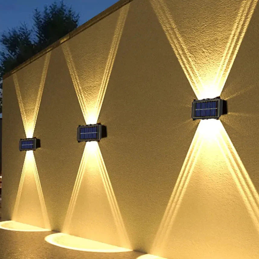 Solar-powered wall light with warm up-and-down dual beam outdoor lighting