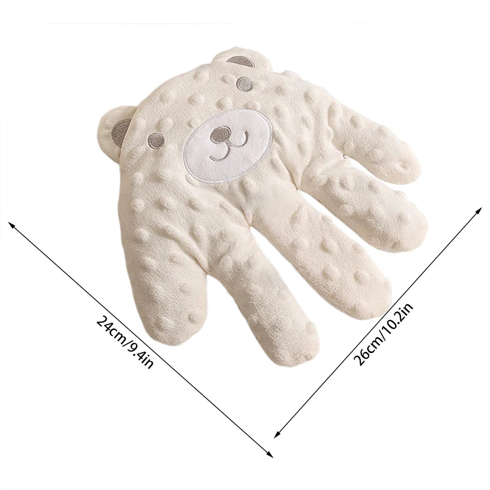 Soft palm-shaped infant sleep pillow with gentle tapping soothing function