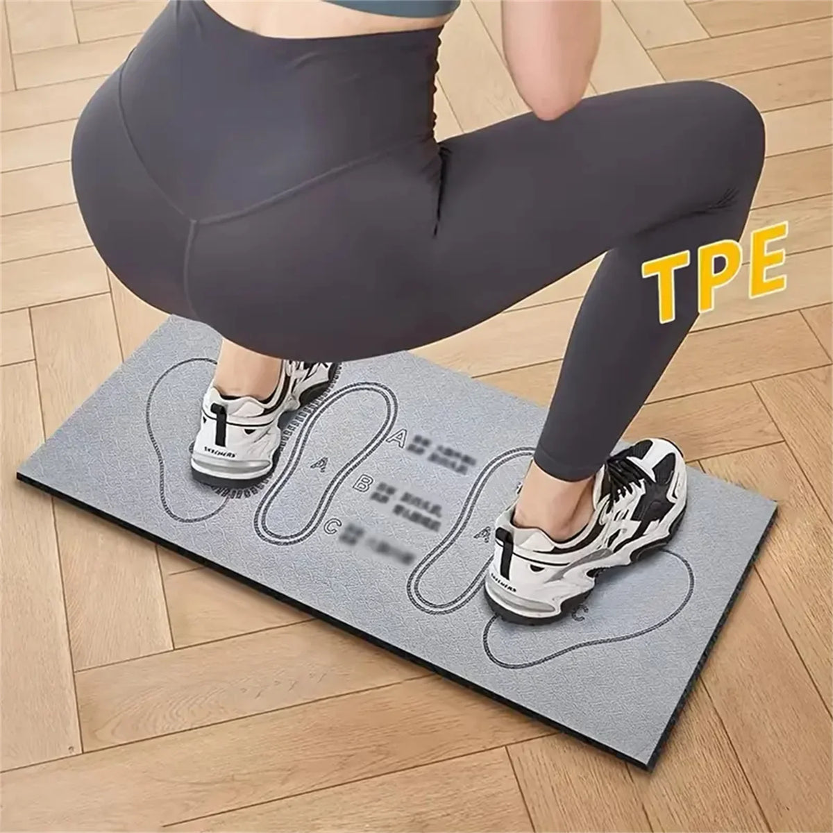 Compact squat guide mat with printed foot placement for exercise training