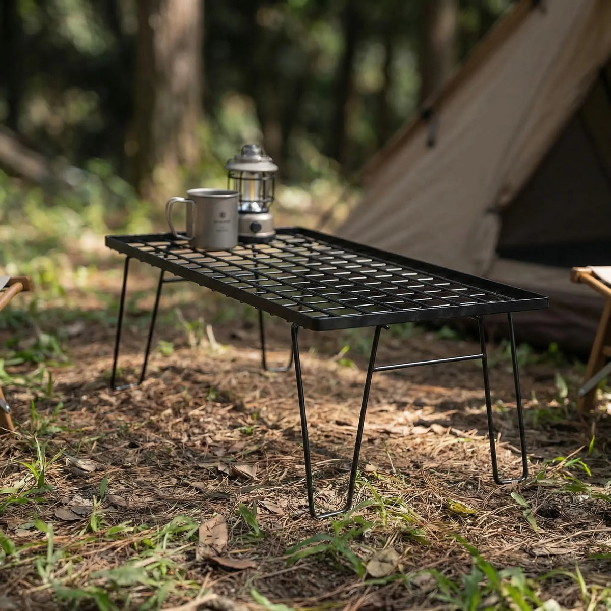 Foldable camping table with mesh top and collapsible legs