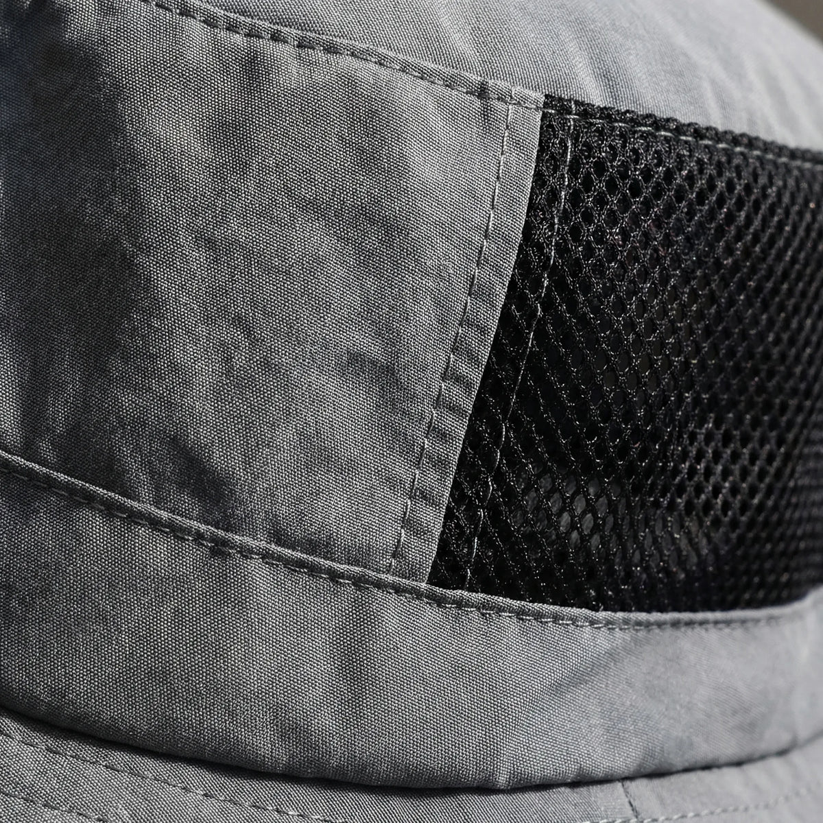 Mesh bucket hat with UPF50+ sun rating and adjustable chin strap