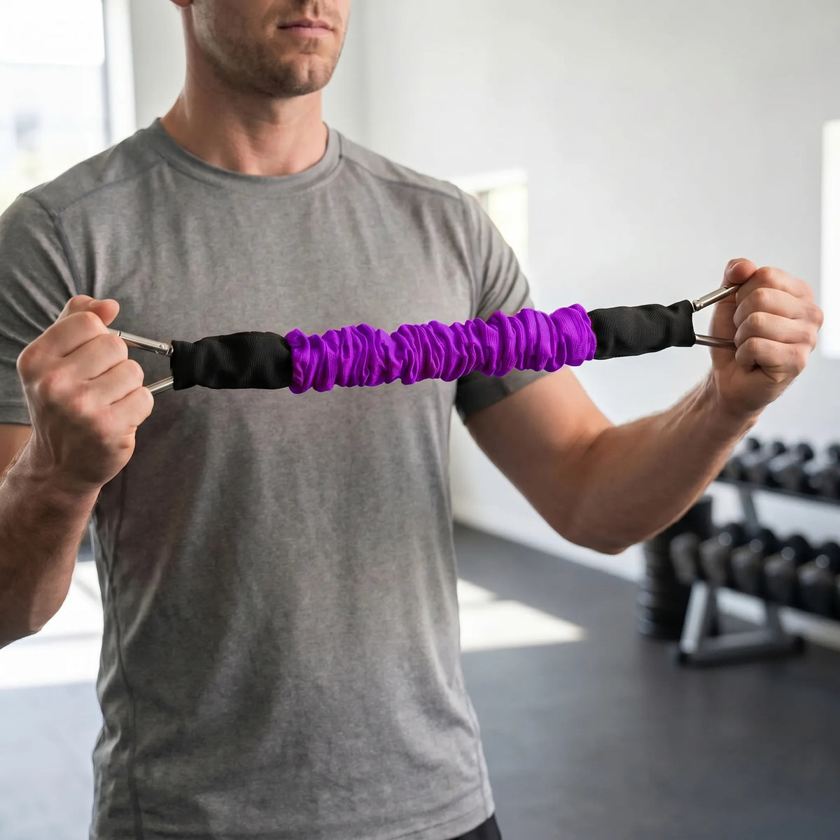 Fabric covered resistance band with metal carabiner clips and progressive tension