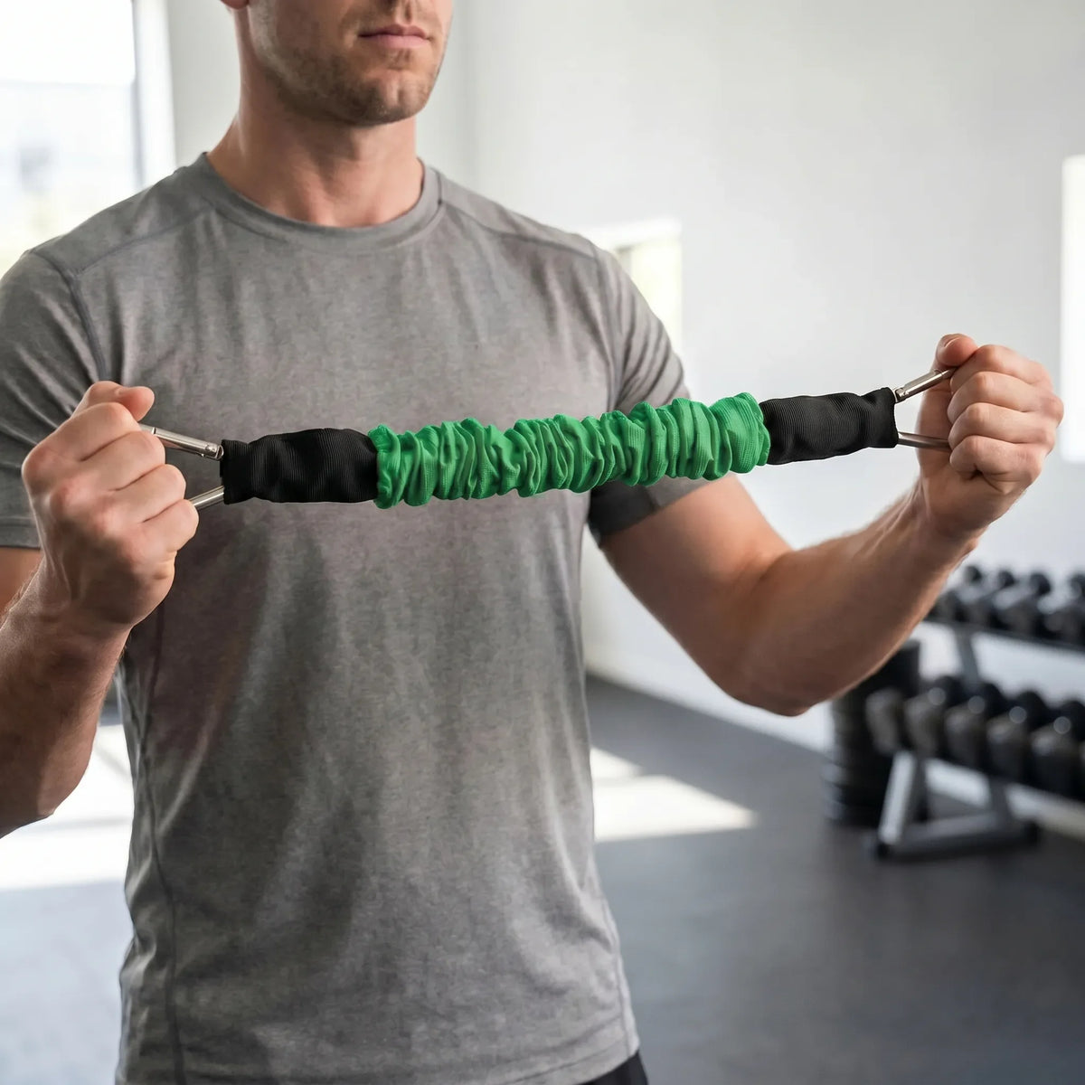 Fabric covered resistance band with metal carabiner clips and progressive tension