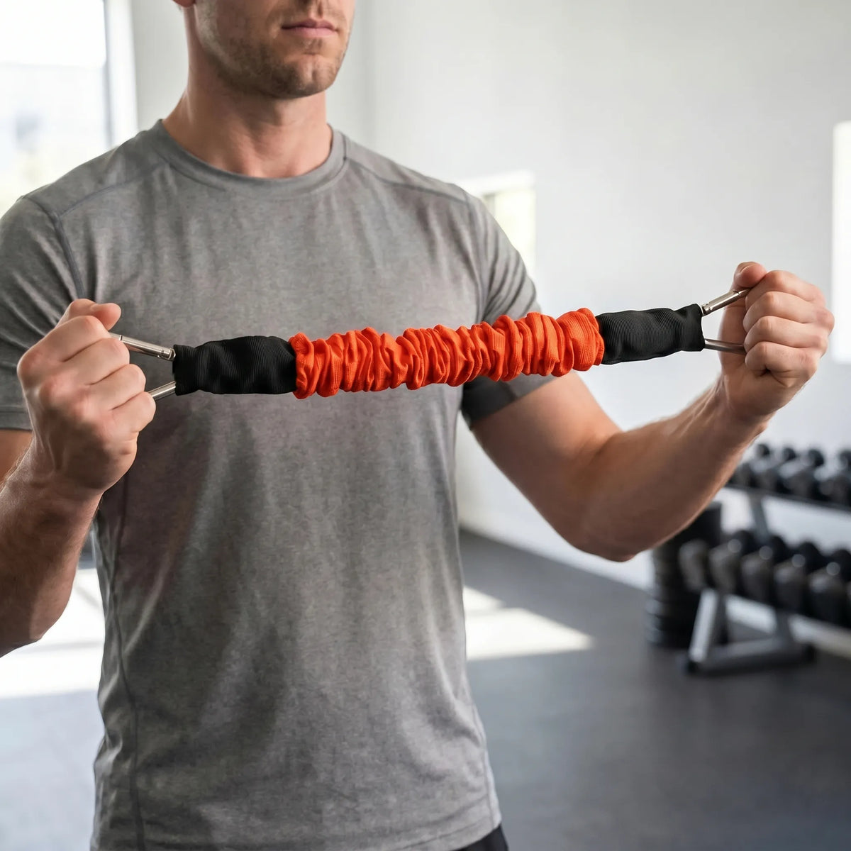 Fabric covered resistance band with metal carabiner clips and progressive tension