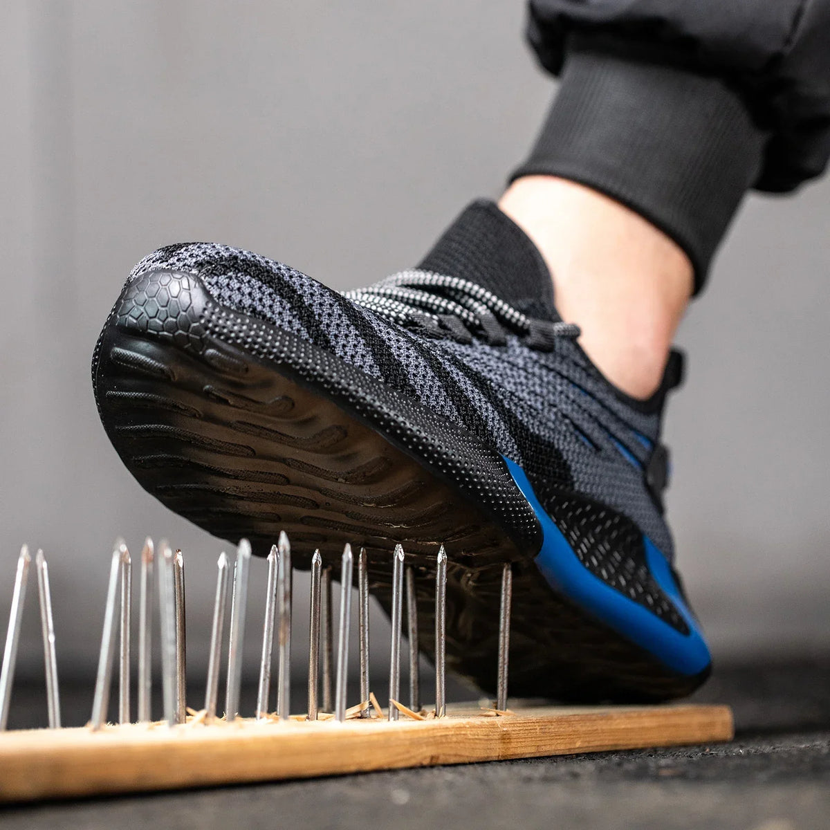 Lightweight protective work shoe with reinforced toe cap and breathable design