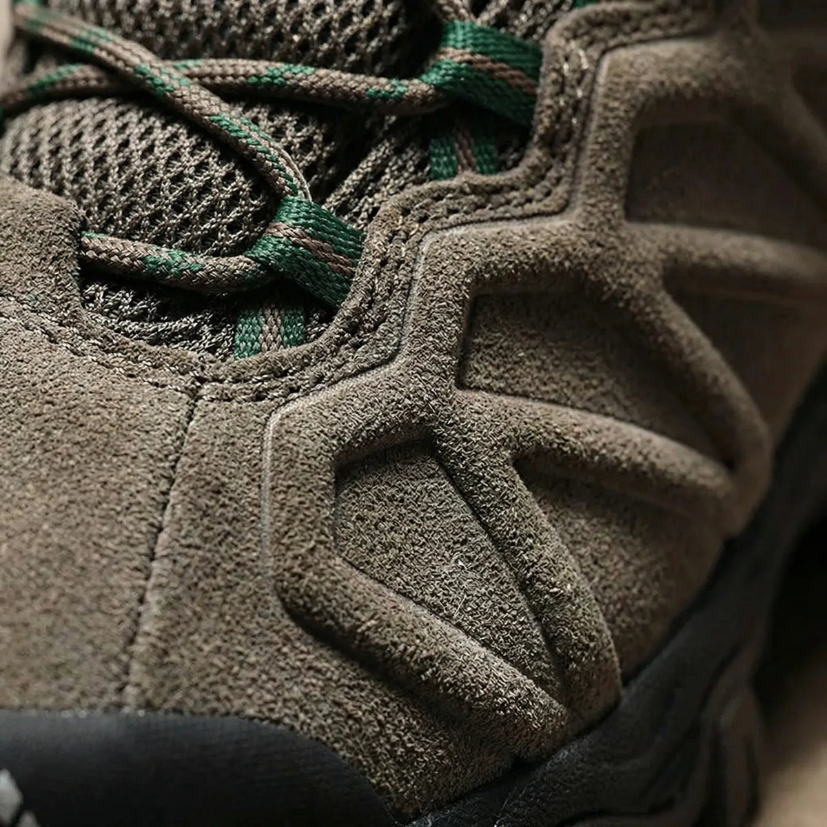 Men's lace-up hiking shoe with grippy sole and reinforced toe protection