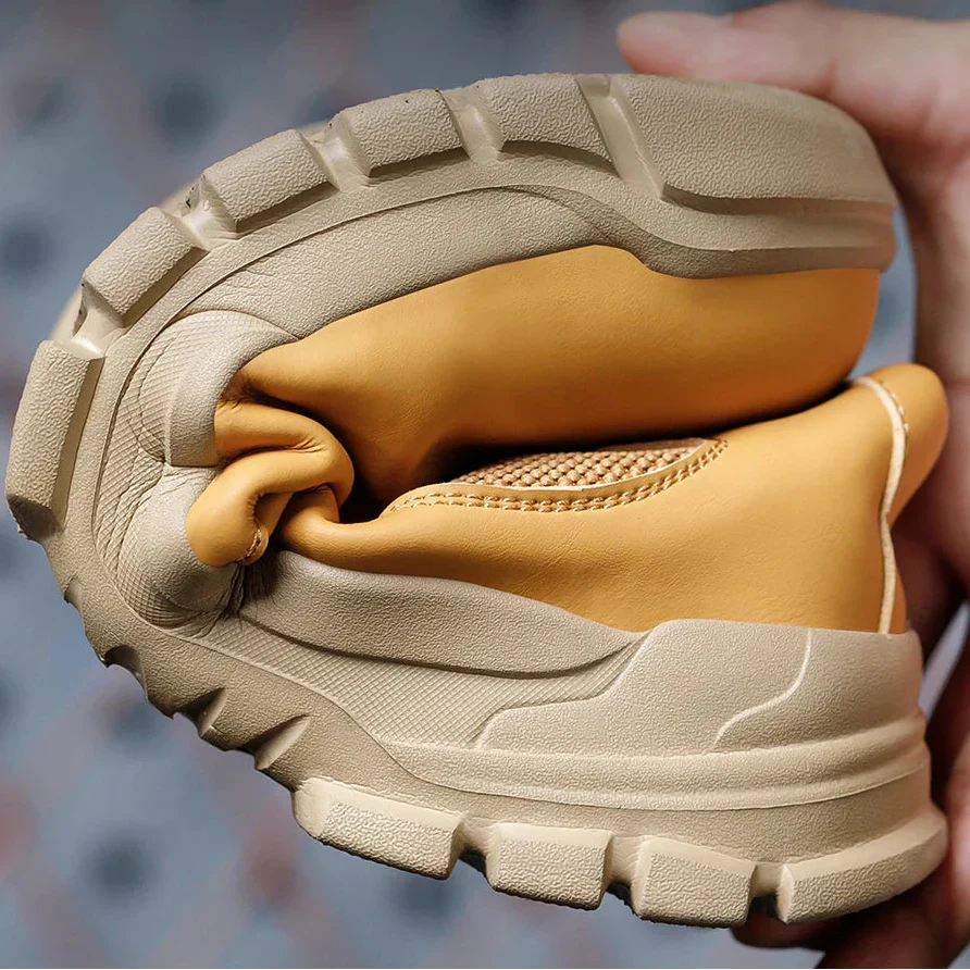 Water-resistant work boot with reinforced toe protection and ankle support