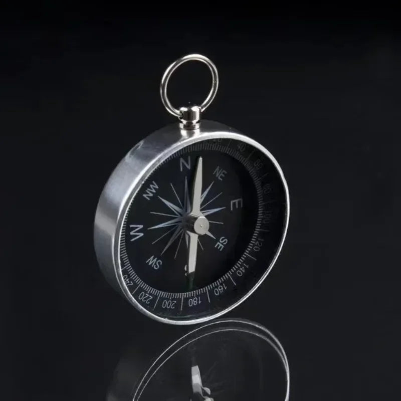 Compact pocket compass with key ring attachment for hiking and camping