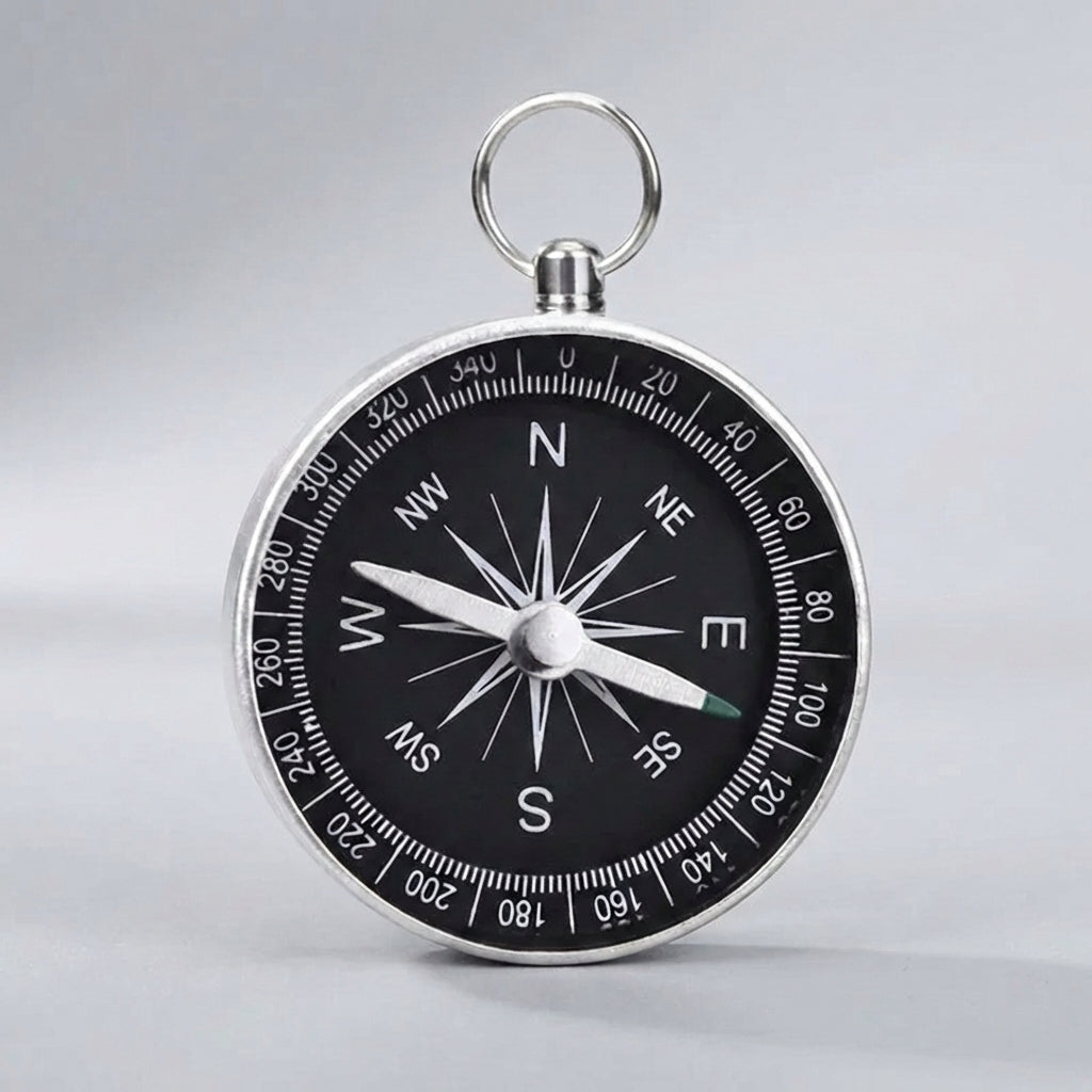 Compact pocket compass with key ring attachment for hiking and camping