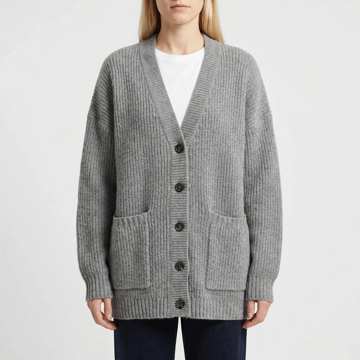 Oversized knit cardigan with deep V-neck and patch pockets for women