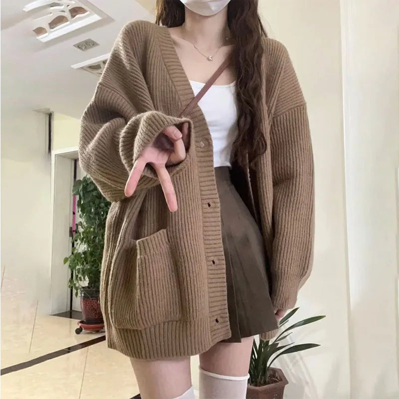 Oversized knit cardigan with deep V-neck and patch pockets for women