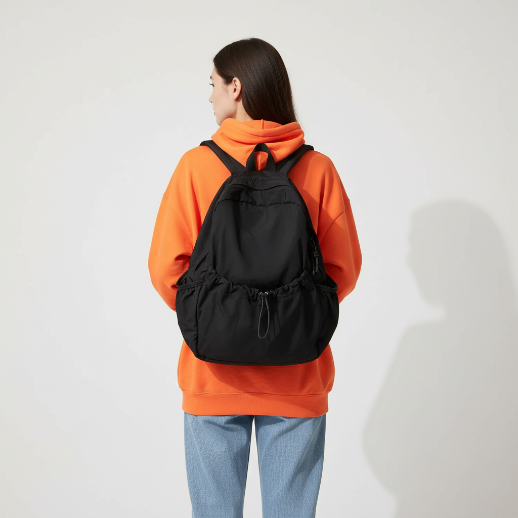 Large-volume nylon backpack with pleated design and padded straps