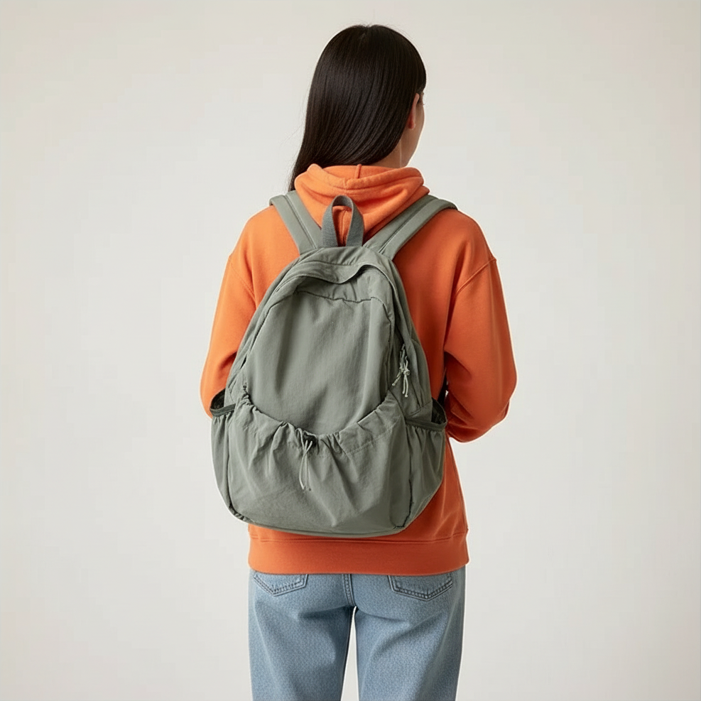 Large-volume nylon backpack with pleated design and padded straps