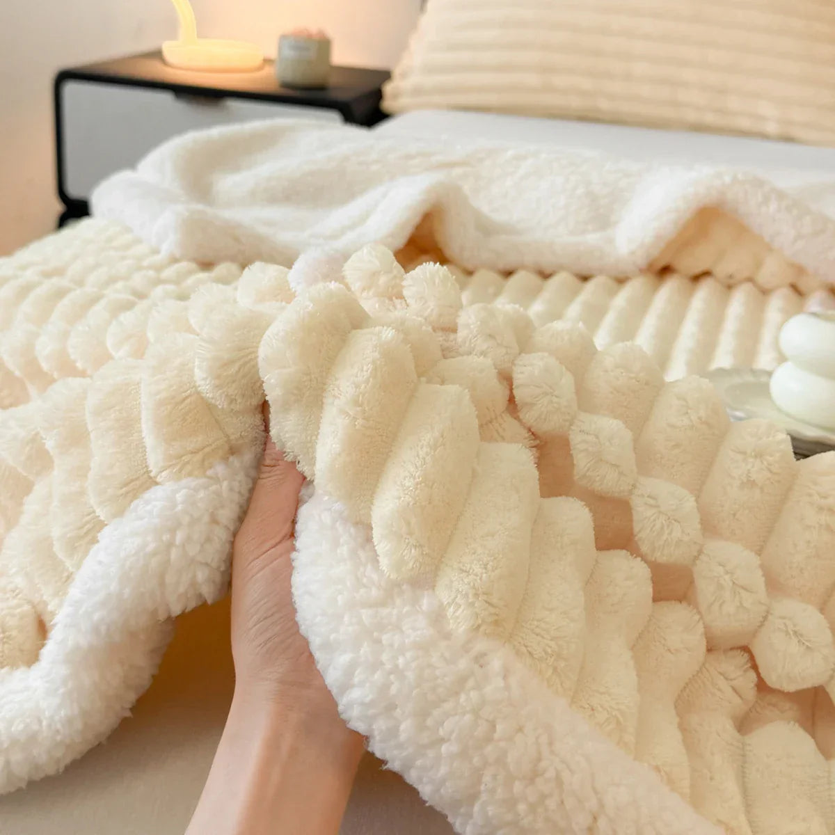 Thick plush throw blanket with soft pile and rib texture