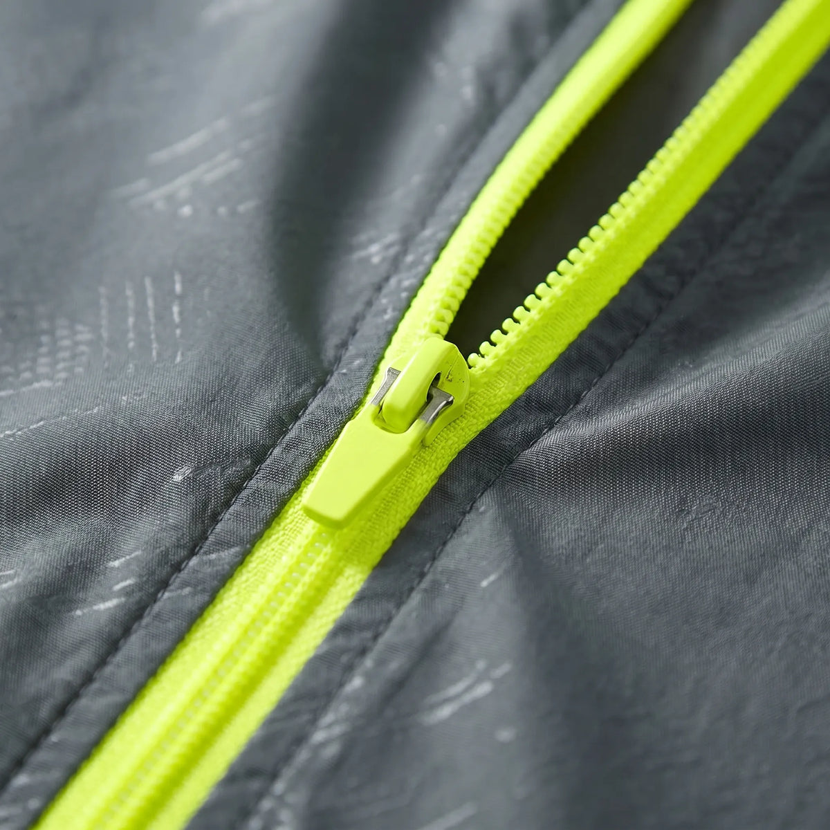 Lightweight hooded windbreaker with water-repellent fabric and packable design
