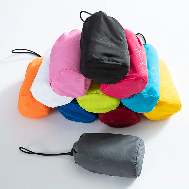 Lightweight hooded windbreaker with water-repellent fabric and packable design