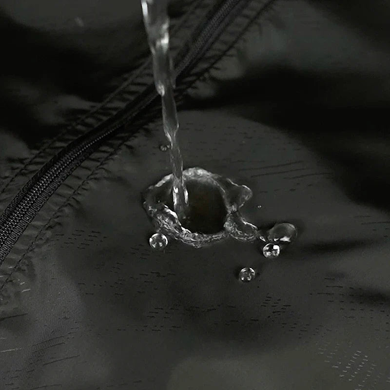 Lightweight hooded windbreaker with water-repellent fabric and packable design