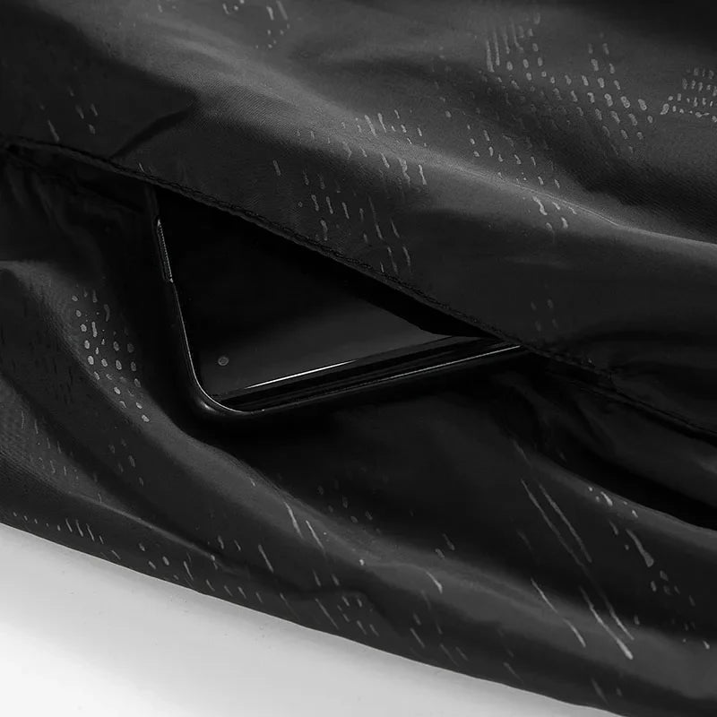 Lightweight hooded windbreaker with water-repellent fabric and packable design