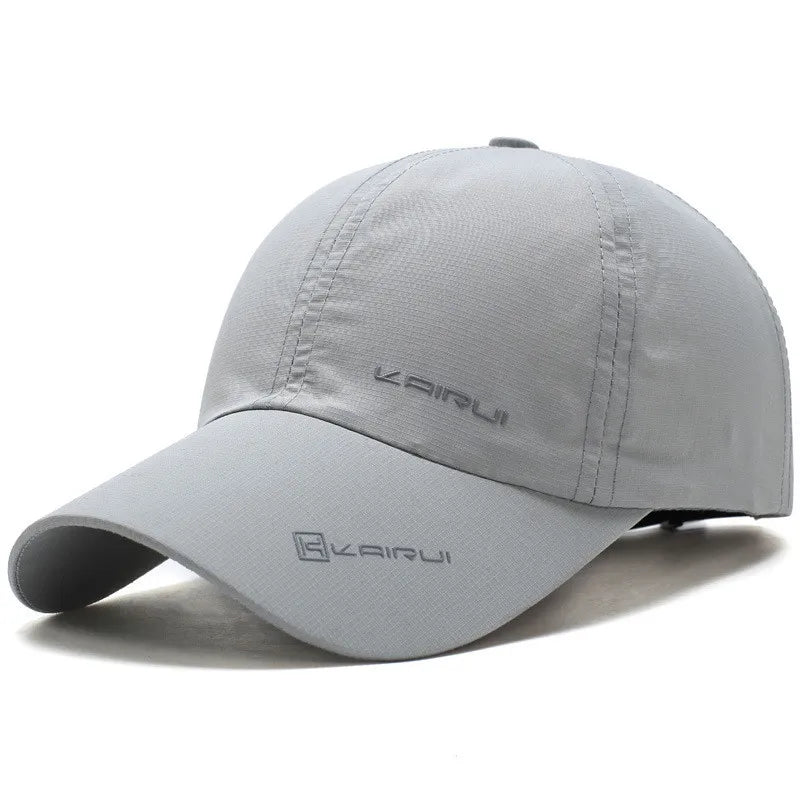 Unisex baseball cap with curved peak and snapback closure, solid colour