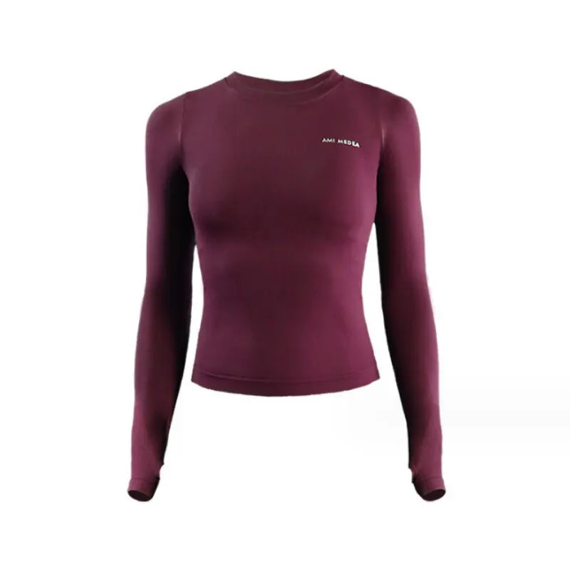 Long sleeve athletic top with seamless construction and thumb cuffs