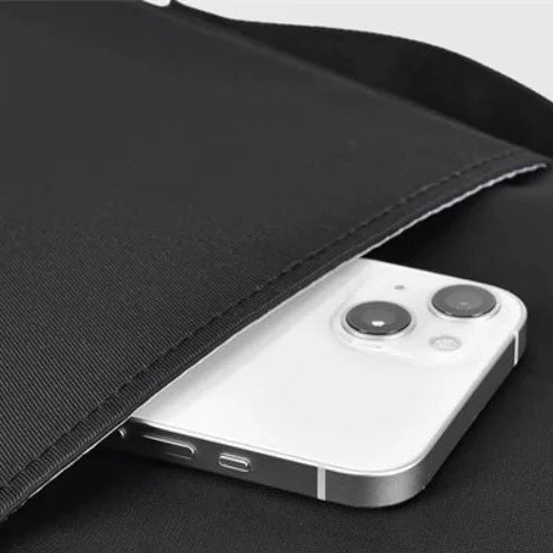 Water-resistant laptop sleeve with shock-absorbing padding and carry handle