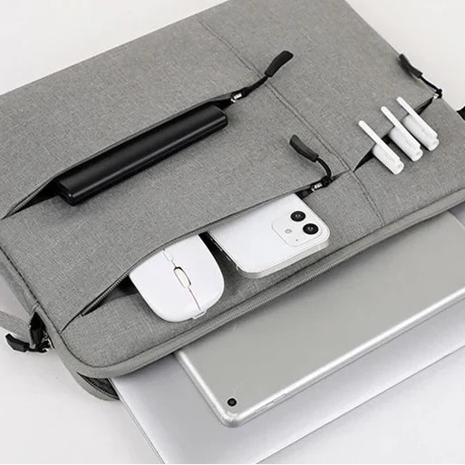 Water-resistant laptop sleeve with padded interior and zip pockets