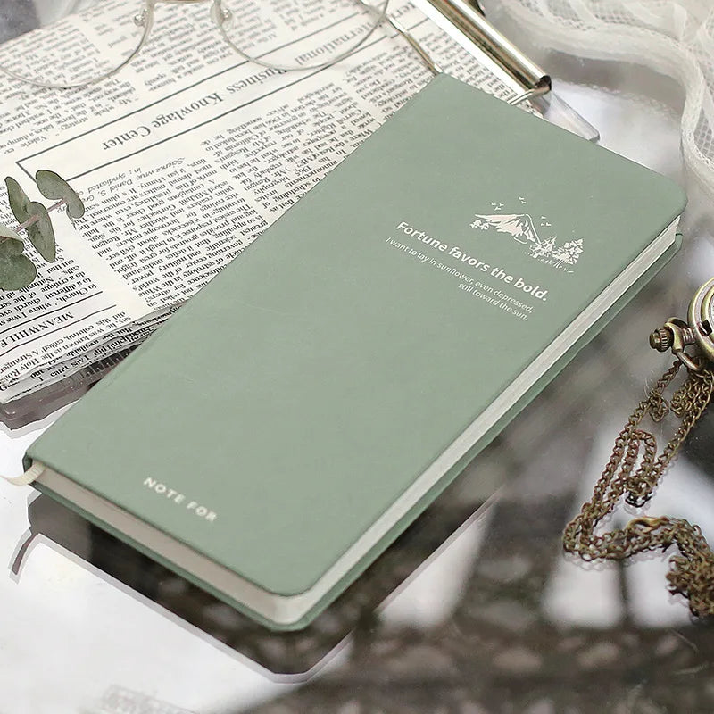Slim weekly planner notebook with retro minimalist design