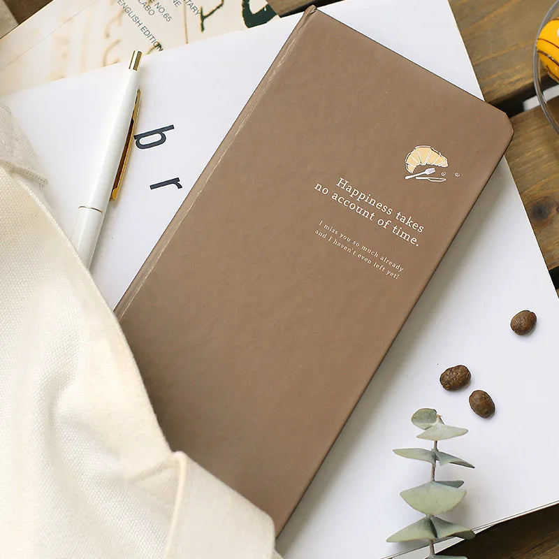 Slim weekly planner notebook with retro minimalist design