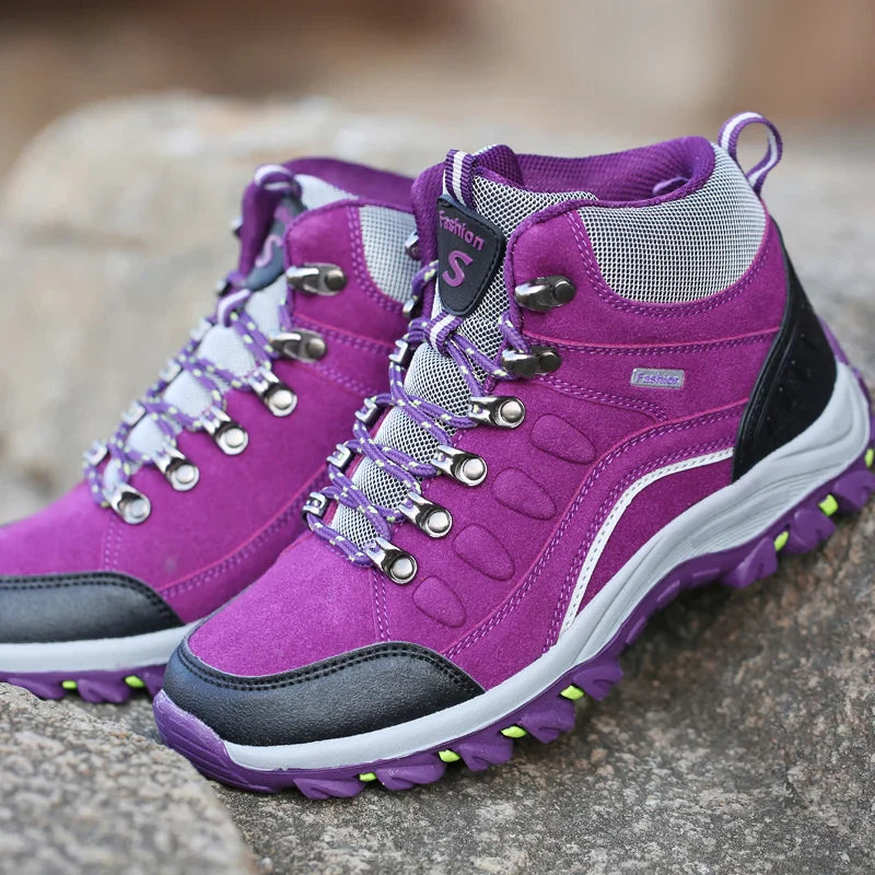 Women's leather hiking boots with ankle support and non-slip traction