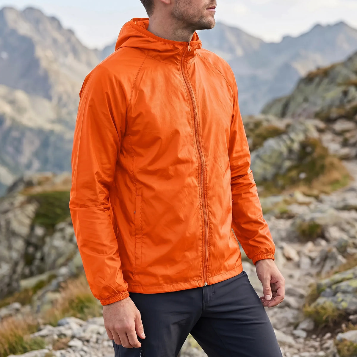 Lightweight packable windbreaker with integrated hood and water-repellent outer