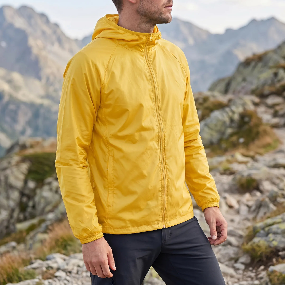 Lightweight packable windbreaker with integrated hood and water-repellent outer